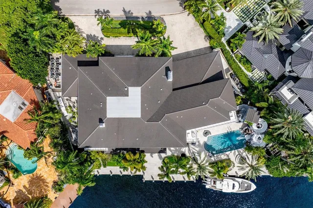 an aerial view of a house with a yard and a garden