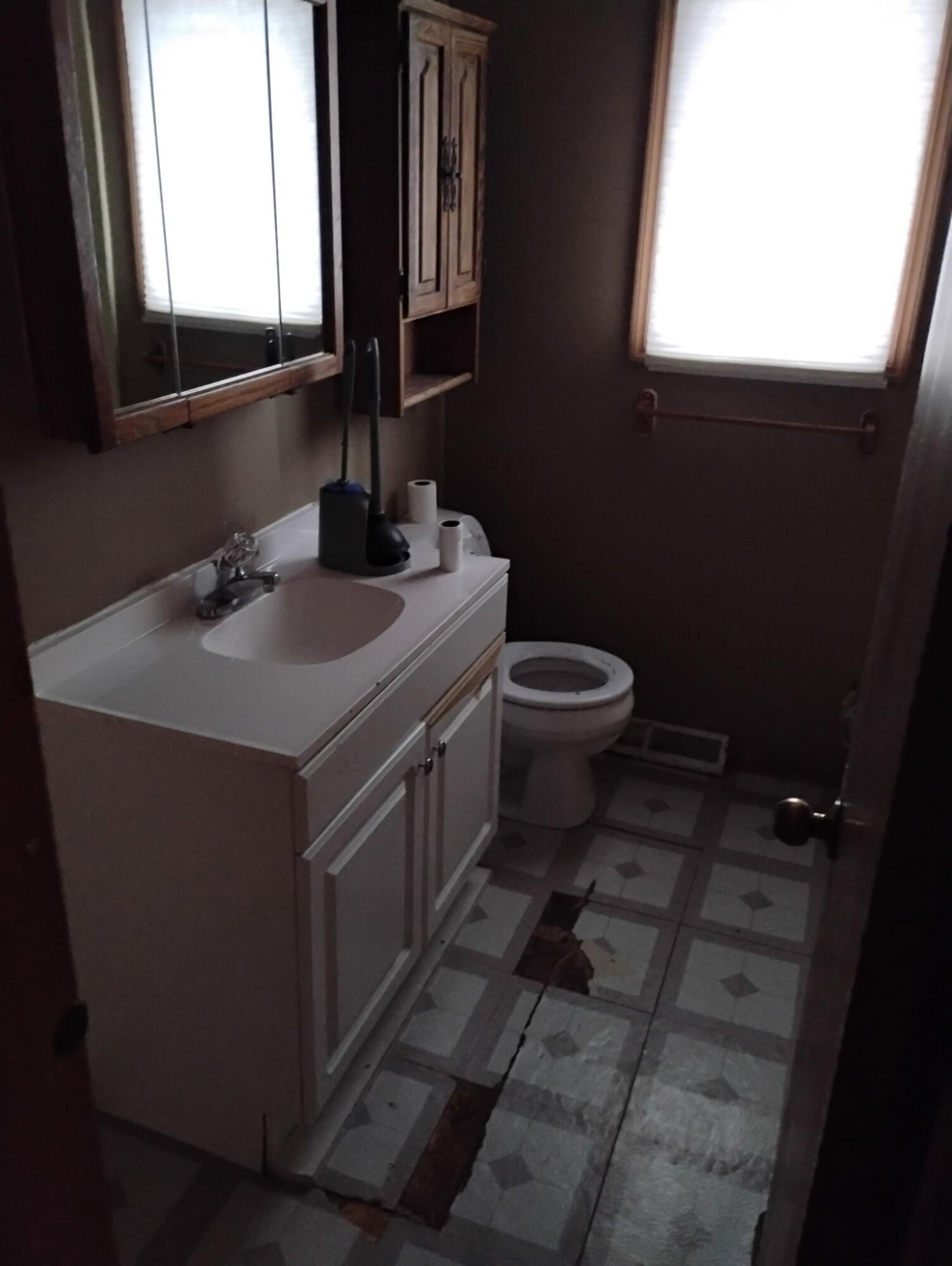 144 Meadow Road Crown Point, IN 46307 - Photo 8 of 10 a bathroom with a sink toilet and mirror