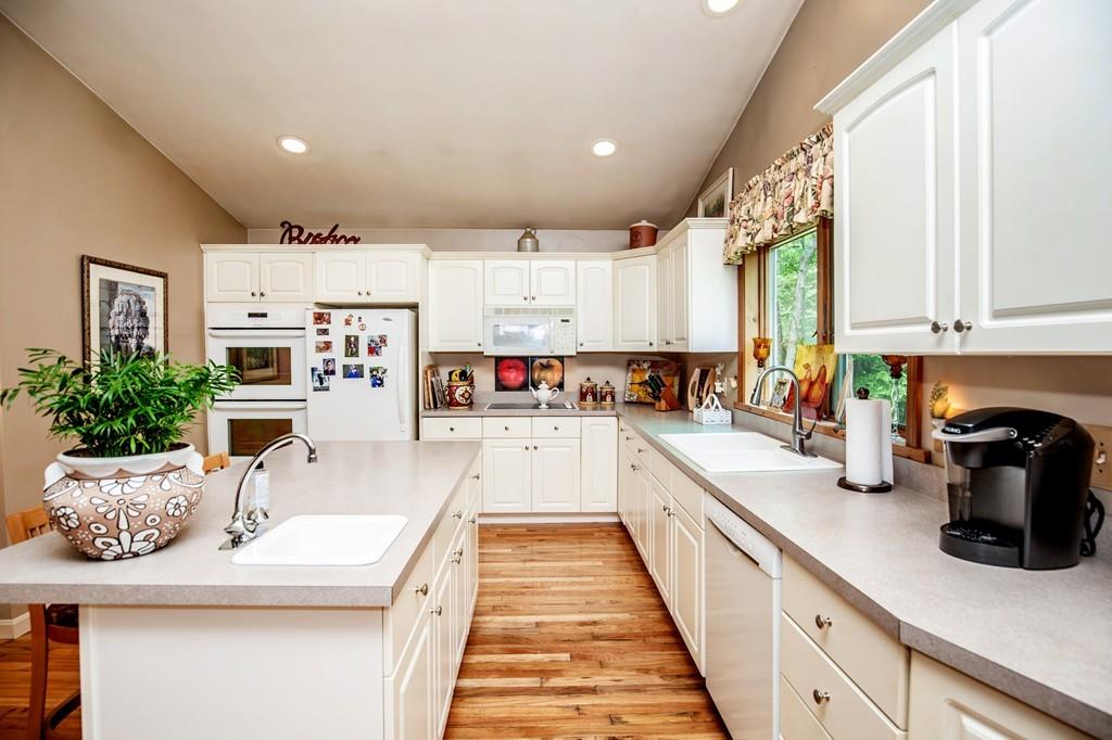 119 Killam Hill Road Boxford, MA 01921 - Photo 12 of 21 a large white kitchen with lots of counter space and a sink
