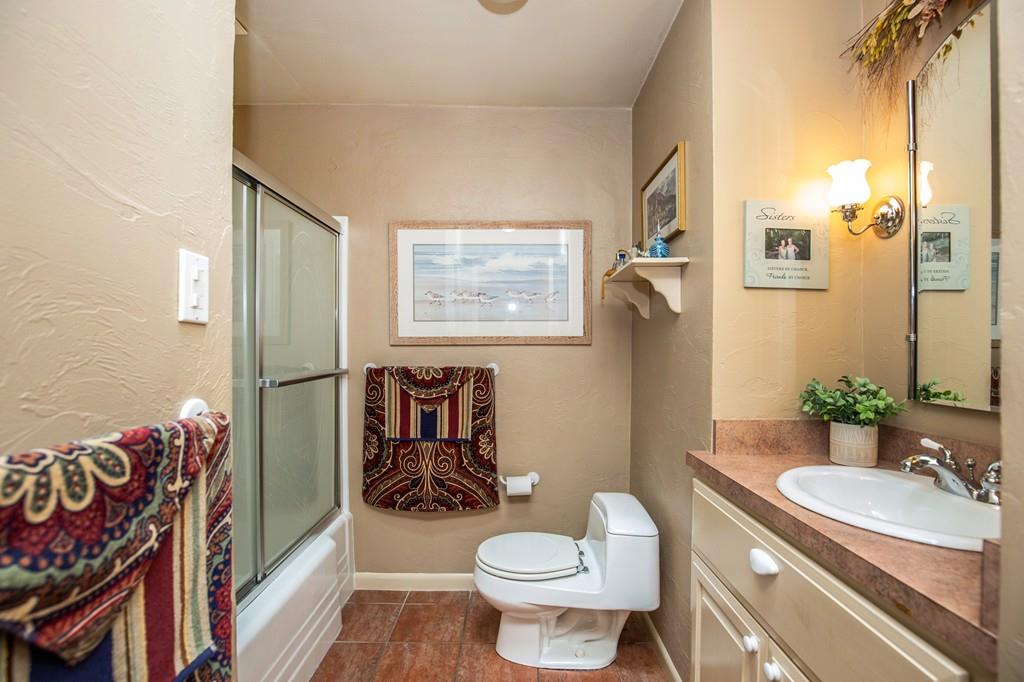 119 Killam Hill Road Boxford, MA 01921 - Photo 14 of 21 a bathroom with a granite countertop toilet sink and mirror