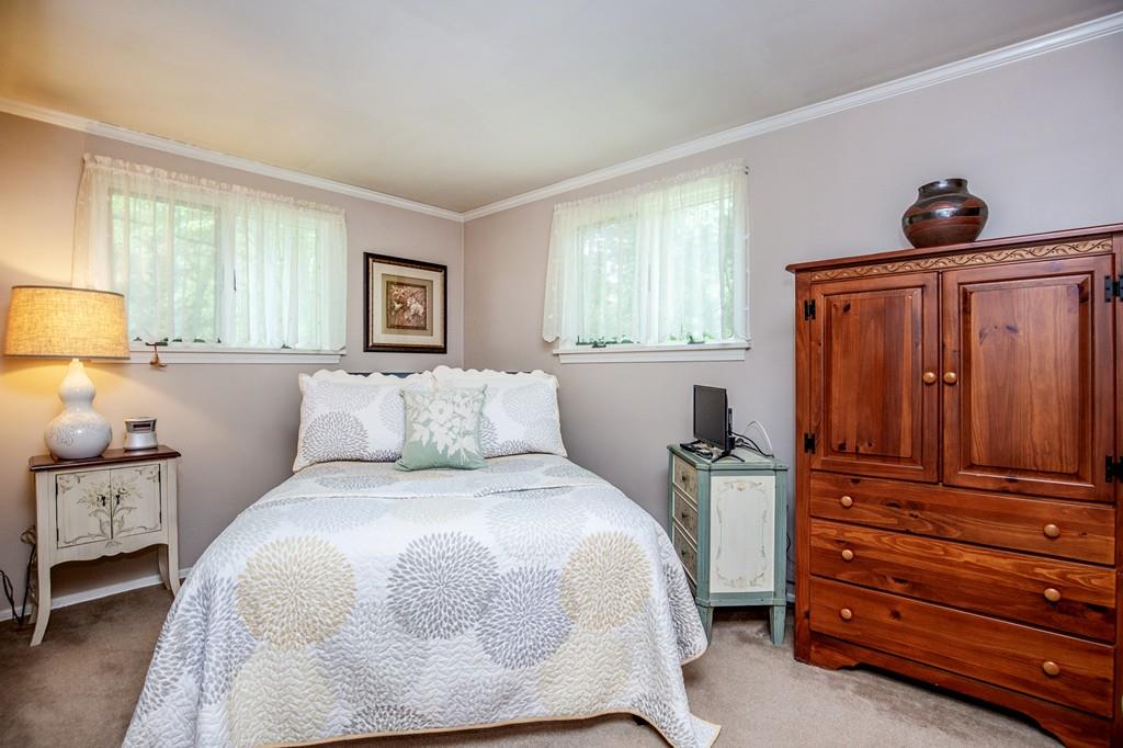 119 Killam Hill Road Boxford, MA 01921 - Photo 15 of 21 a bedroom with a bed and wooden floor