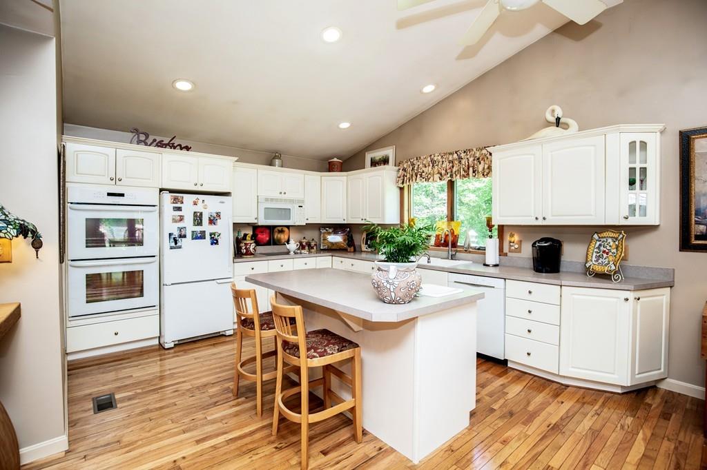 119 Killam Hill Road Boxford, MA 01921 - Photo 4 of 21 a kitchen with white cabinets and appliances