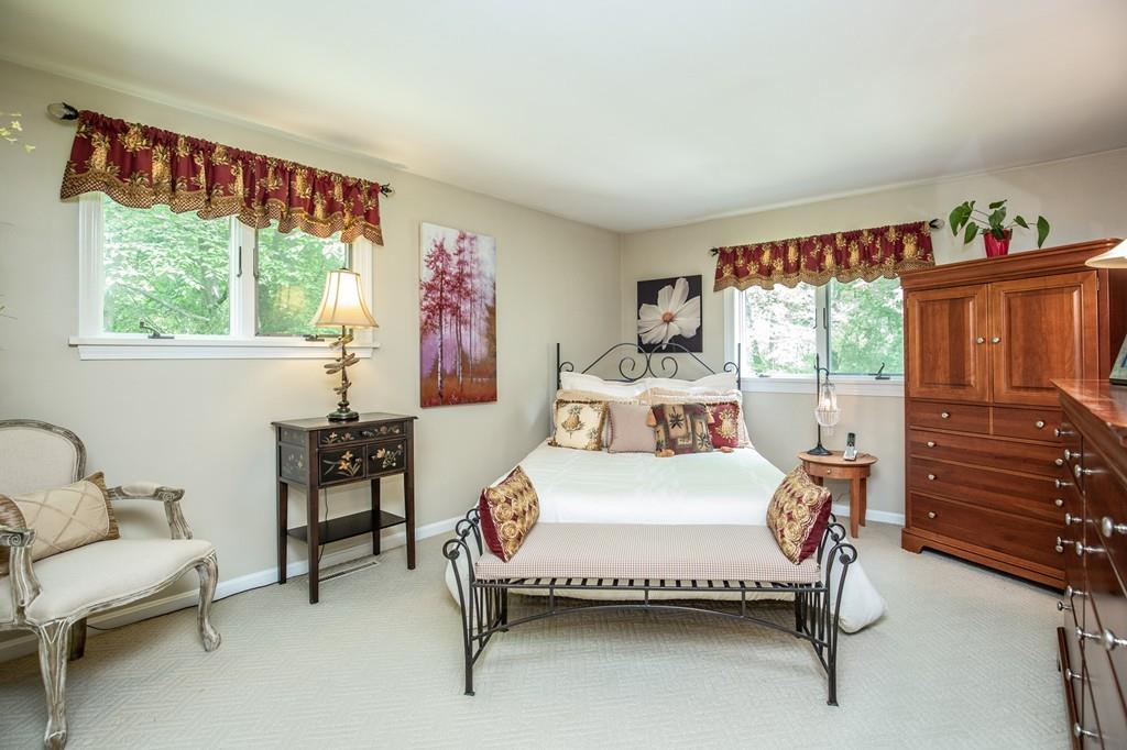 119 Killam Hill Road Boxford, MA 01921 - Photo 5 of 21 a bedroom with a bed and a dresser next to a window