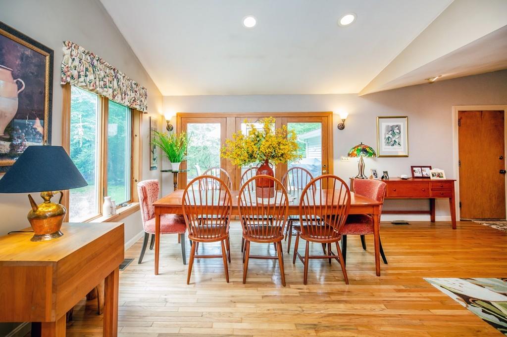 119 Killam Hill Road Boxford, MA 01921 - Photo 10 of 21 a dining room with furniture a chandelier and wooden floor