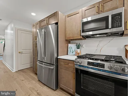 a kitchen with a stove and a microwave
