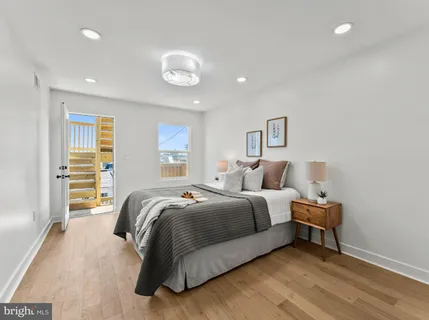 a bed room with a bed and a window