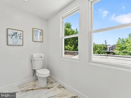 a bathroom with a sink and a window