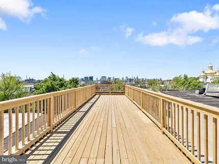 a view of a terrace with a garden and deck
