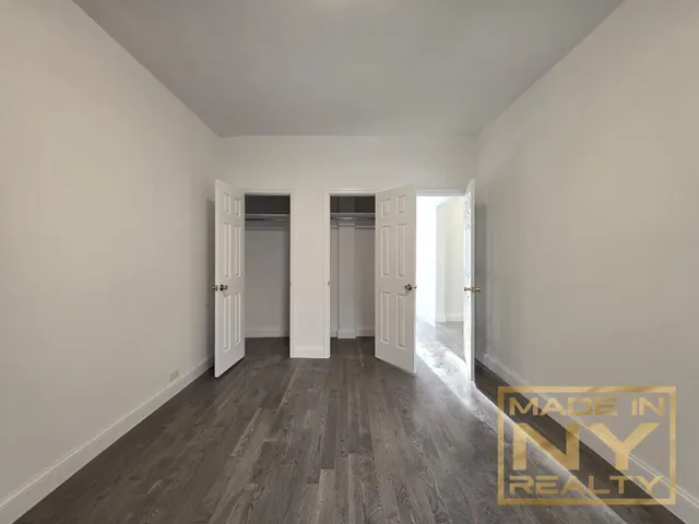 a view of a livingroom with wooden floor