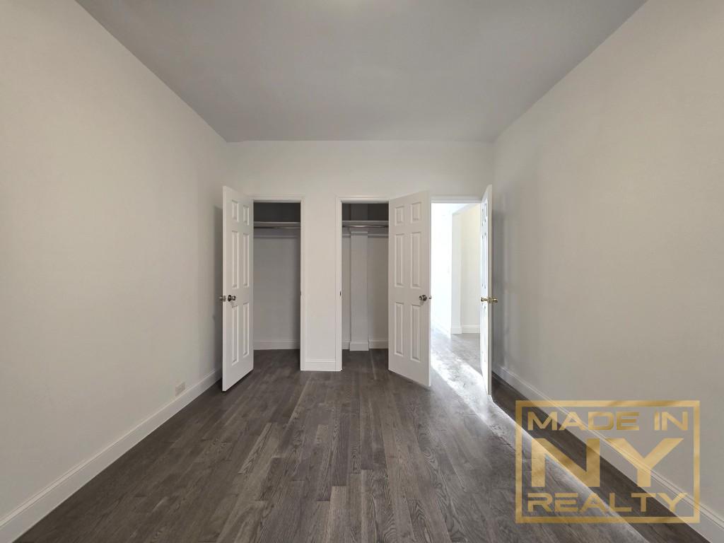 117-14 Union Turnpike, Unit EB2 Queens, NY 11415 - Photo 7 of 10 a view of a livingroom with wooden floor