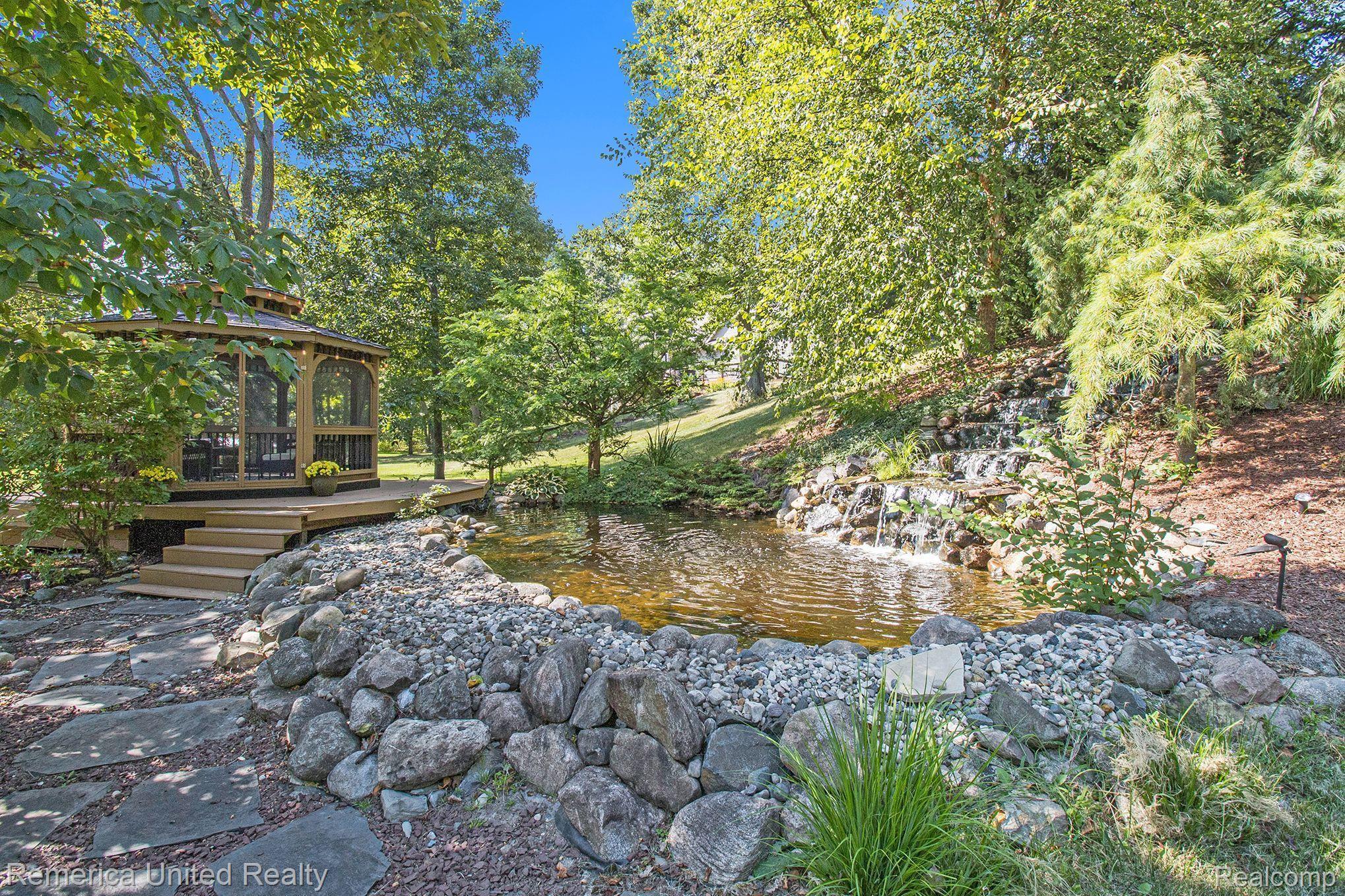 3470 East Highland Road Howell, MI 48843 - Photo 3 of 66 Gazebo, Koi Pond & Waterfall