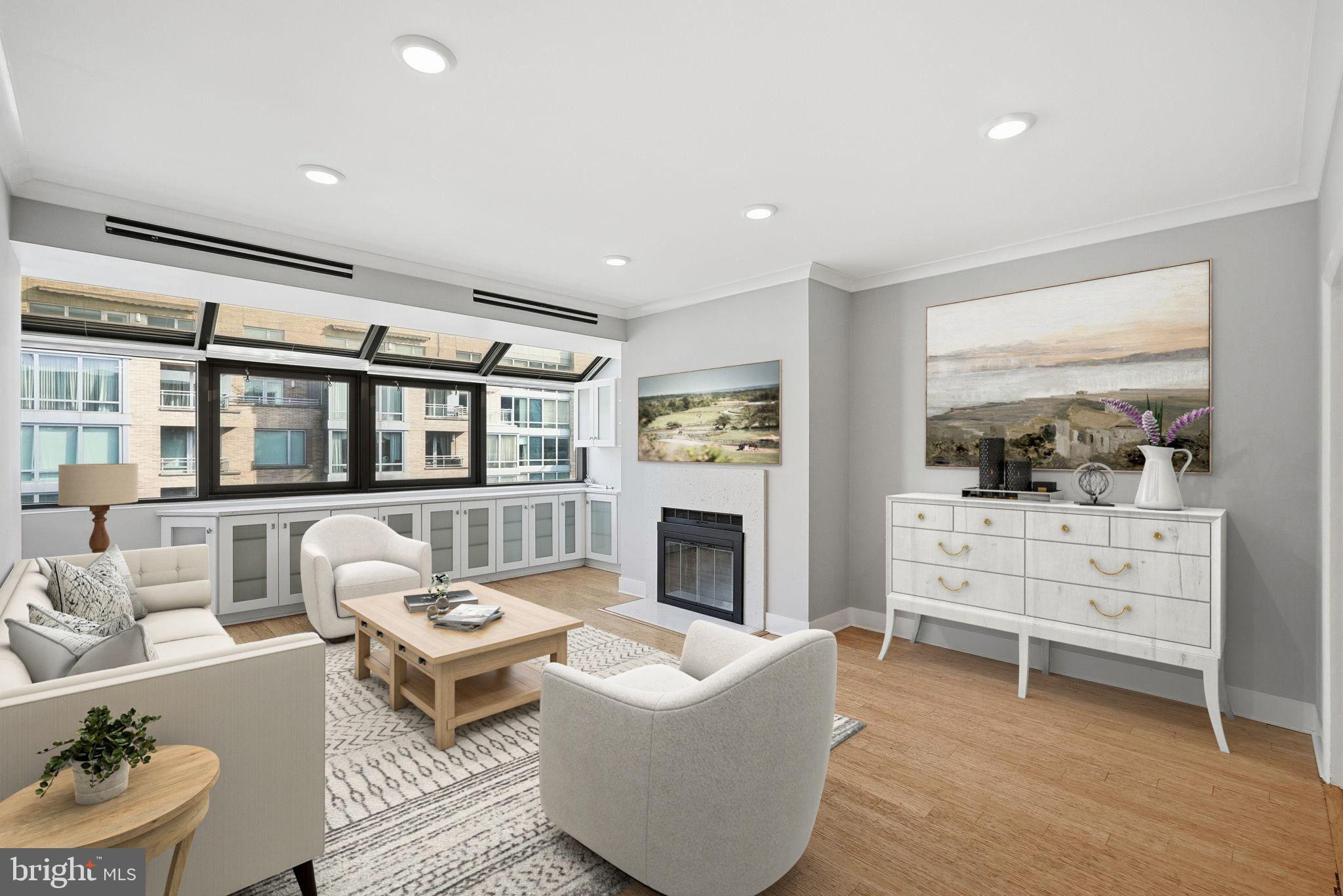 1140 23rd Street Northwest, Unit 1005 Washington, DC 20037 - Photo 1 of 22 a living room with furniture and a fireplace