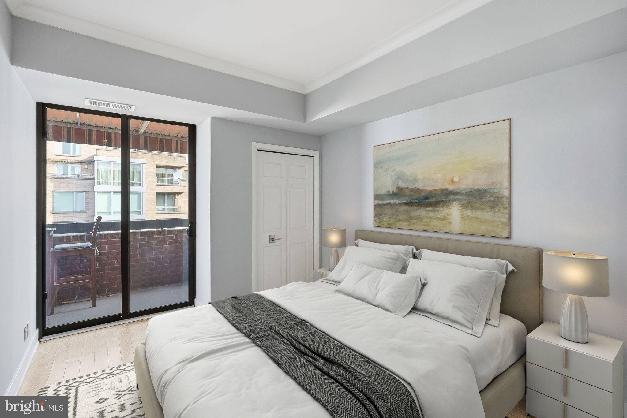 1140 23rd Street Northwest, Unit 1005 Washington, DC 20037 - Photo 13 of 22 a bedroom with a bed and a painting on the wall