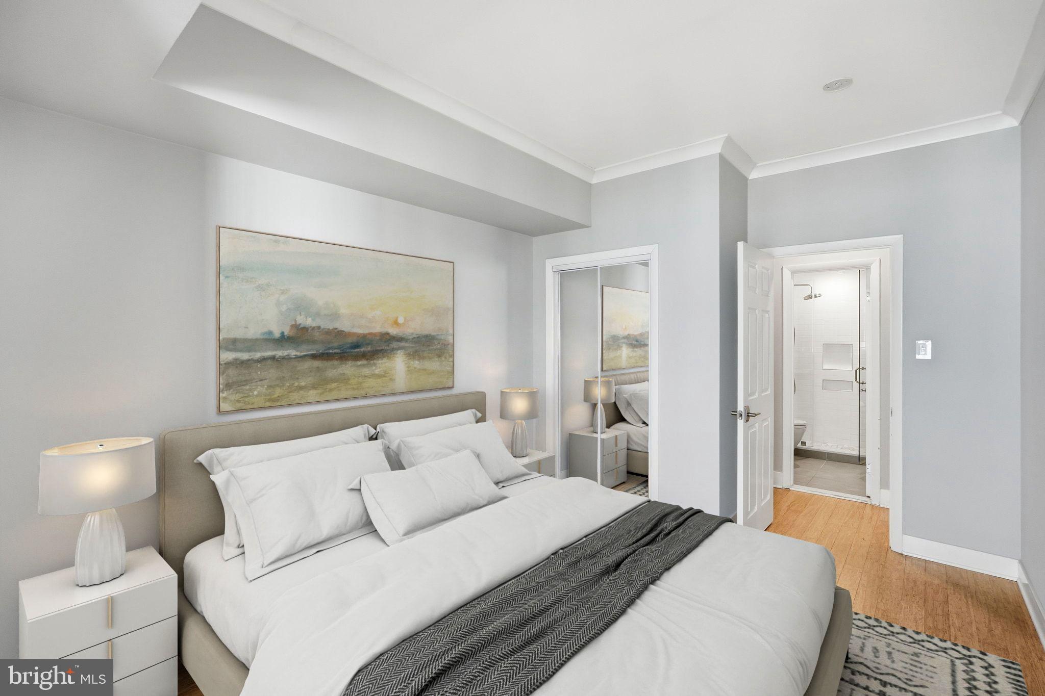 1140 23rd Street Northwest, Unit 1005 Washington, DC 20037 - Photo 14 of 22 a bedroom with a bed and a painting on the wall