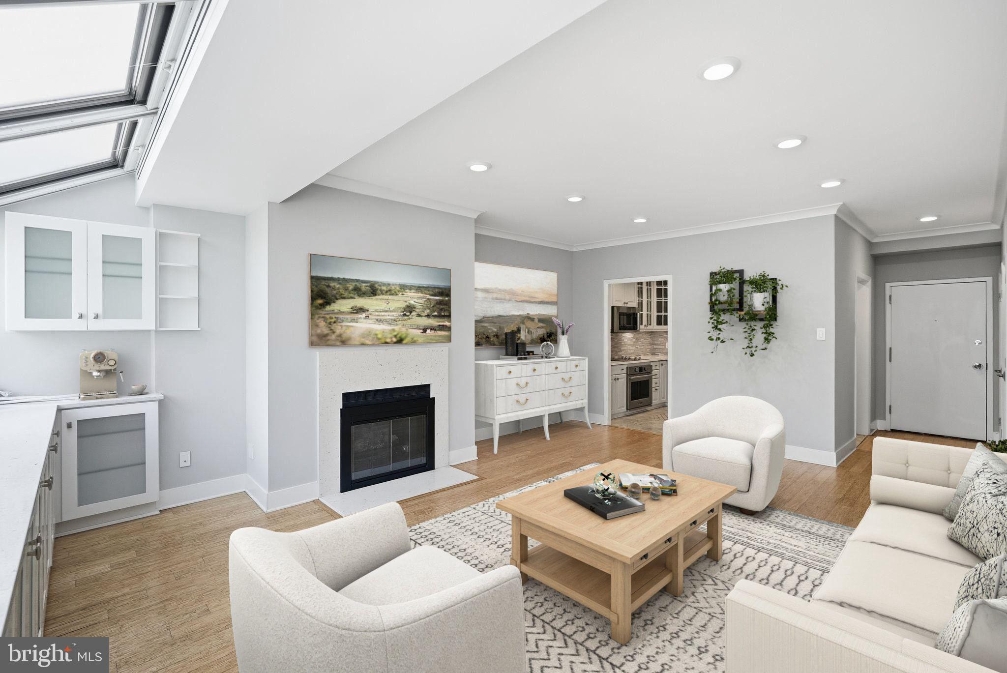 1140 23rd Street Northwest, Unit 1005 Washington, DC 20037 - Photo 2 of 22 a living room with furniture and a fireplace