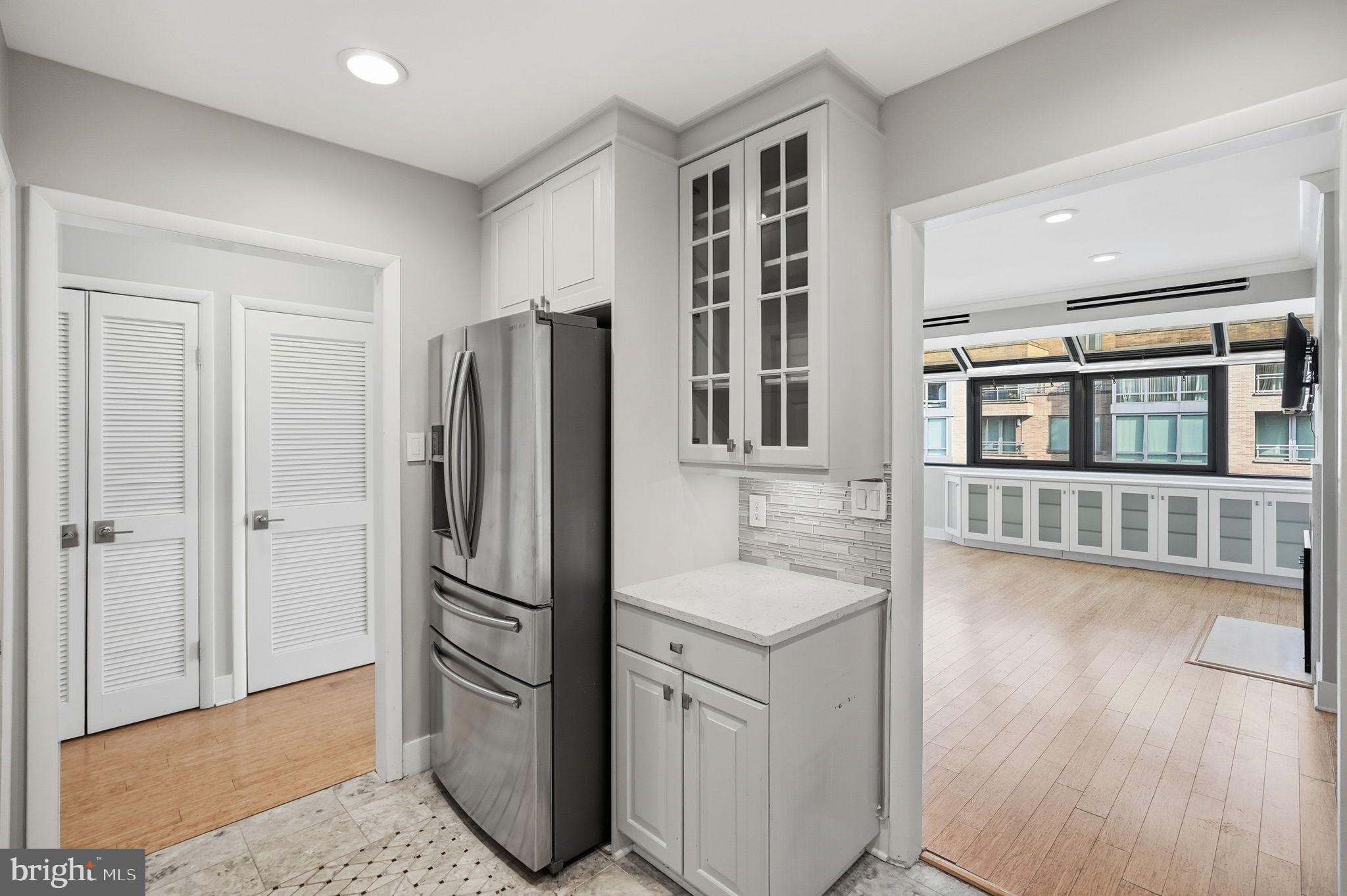 1140 23rd Street Northwest, Unit 1005 Washington, DC 20037 - Photo 5 of 22 a kitchen with stainless steel appliances granite countertop a refrigerator and a sink