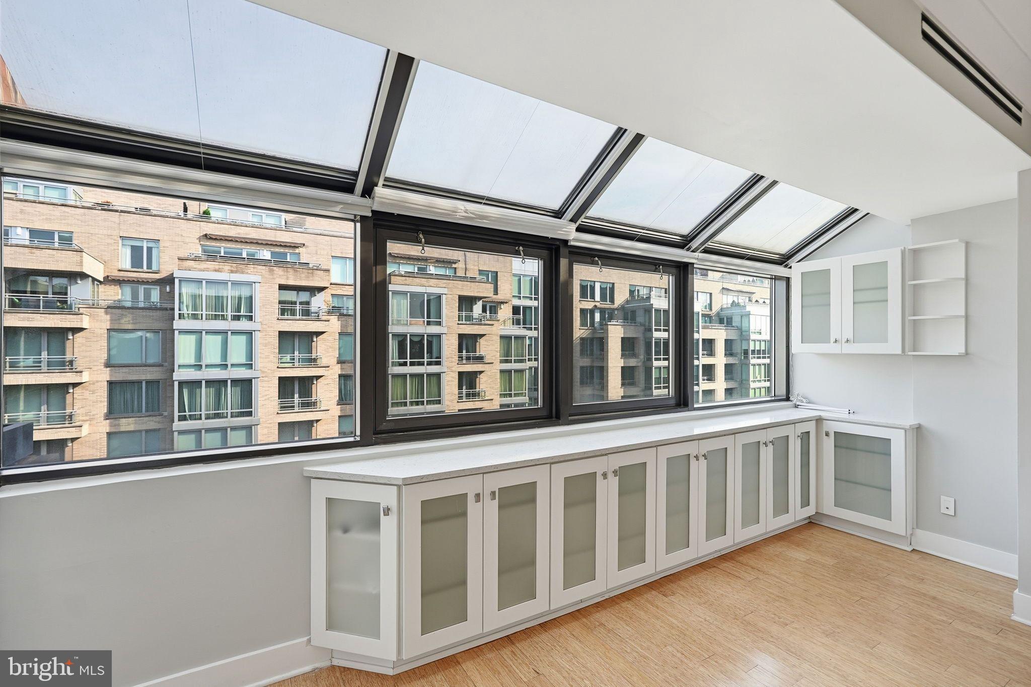1140 23rd Street Northwest, Unit 1005 Washington, DC 20037 - Photo 6 of 22 a view of an empty room with a window