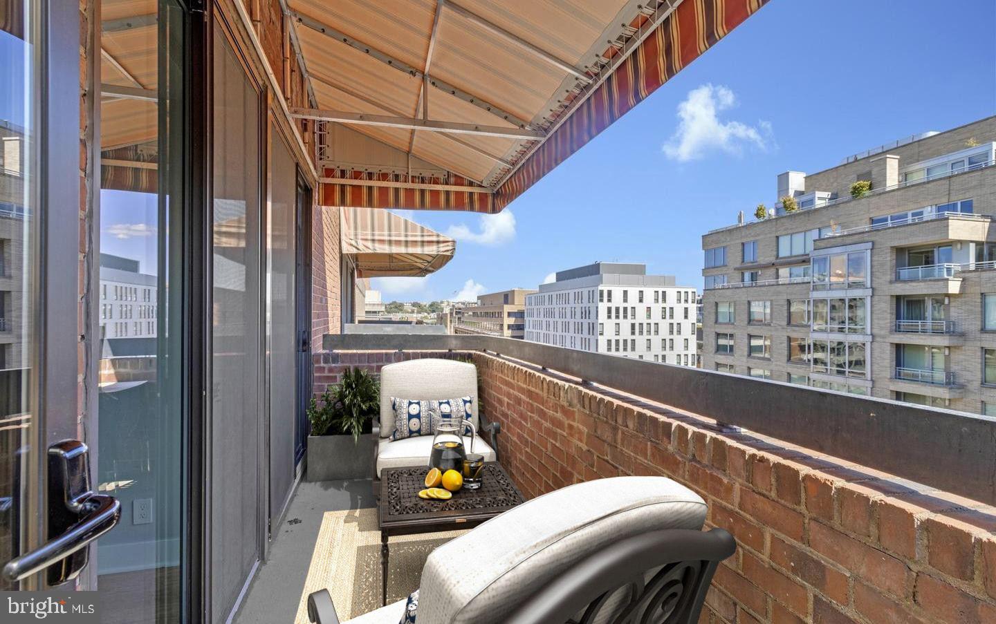1140 23rd Street Northwest, Unit 1005 Washington, DC 20037 - Photo 7 of 22 a view of city from balcony with furniture