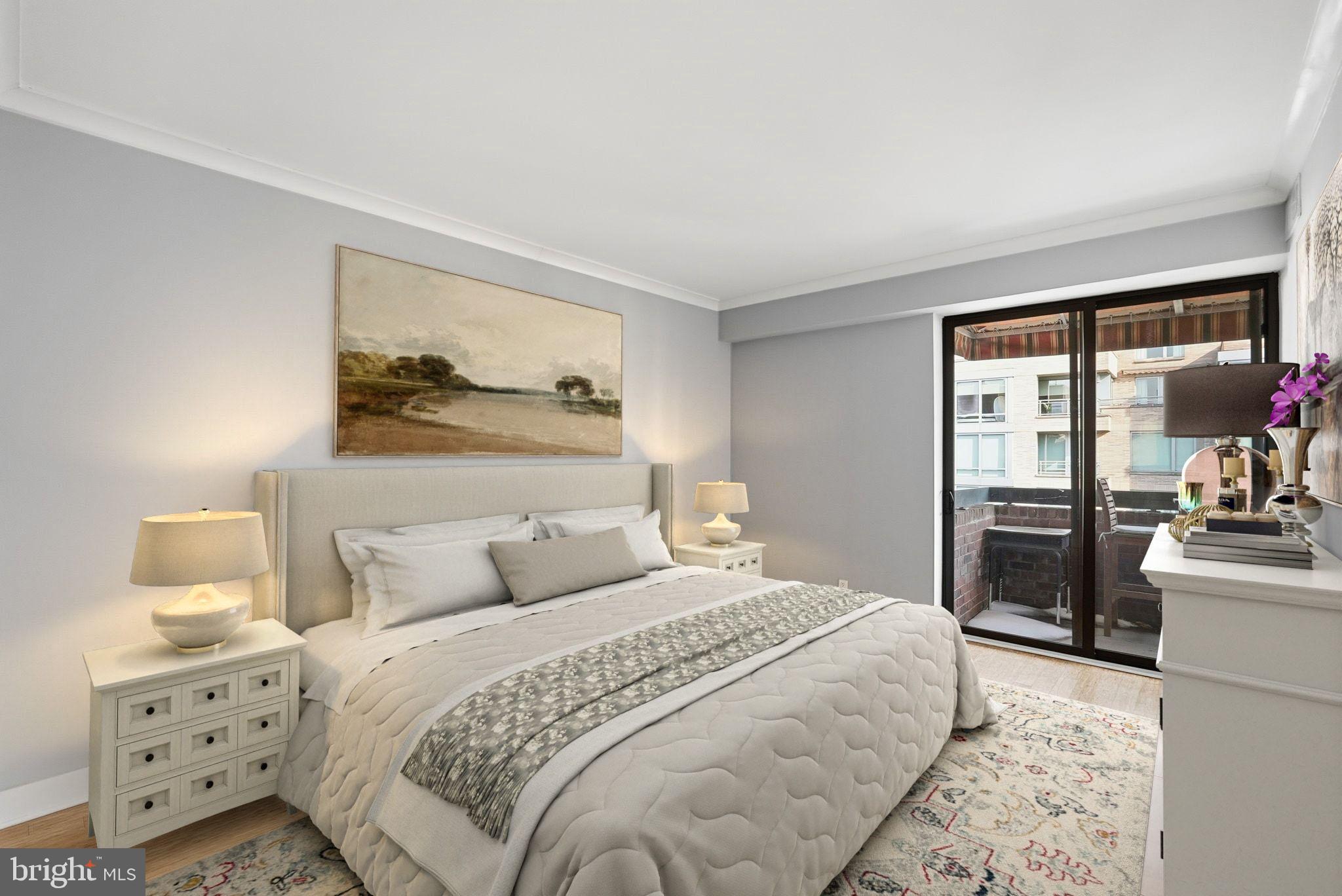 1140 23rd Street Northwest, Unit 1005 Washington, DC 20037 - Photo 8 of 22 a bedroom with a large bed and a flat tv screen on dresser
