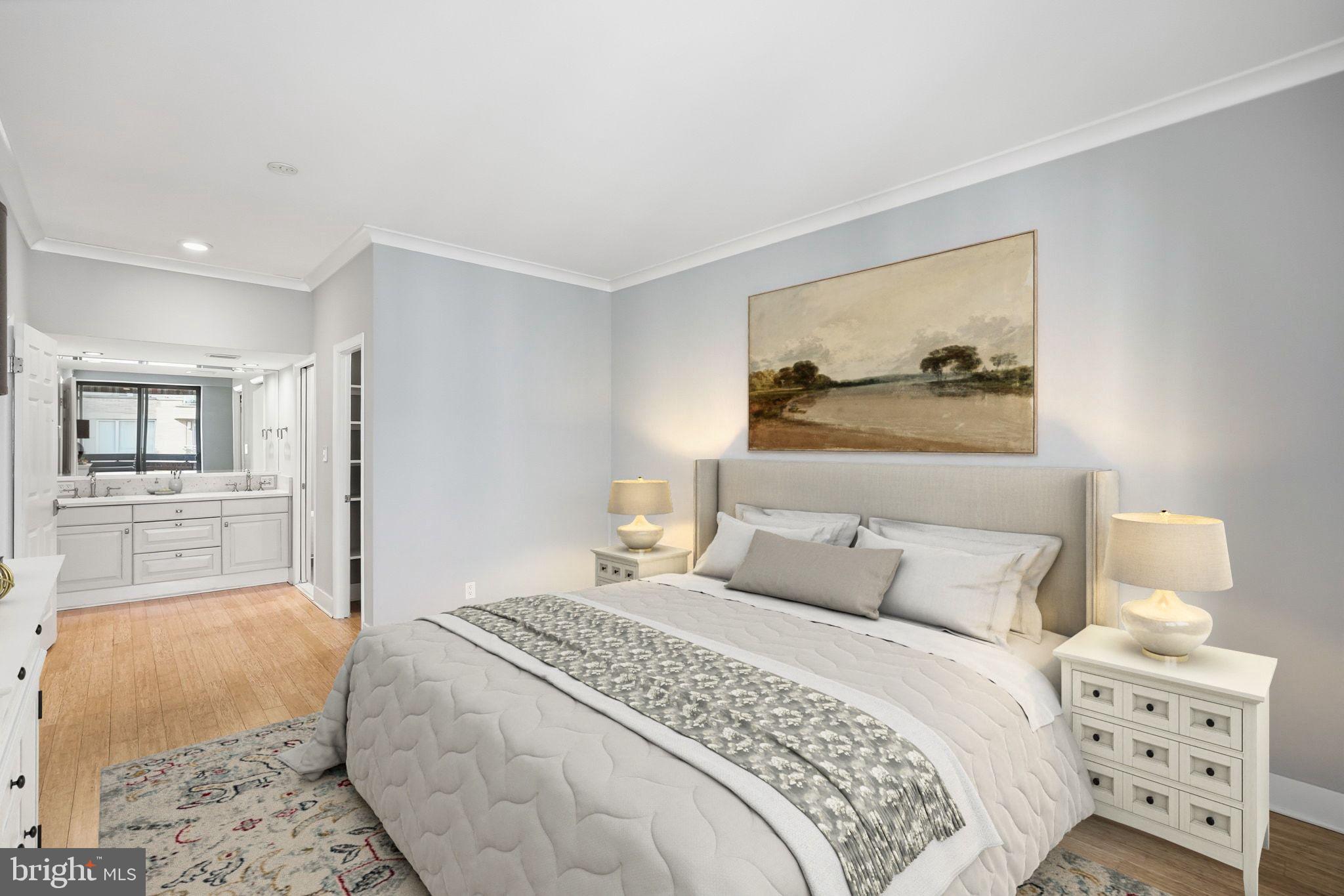 1140 23rd Street Northwest, Unit 1005 Washington, DC 20037 - Photo 9 of 22 a bedroom with a bed and a couch