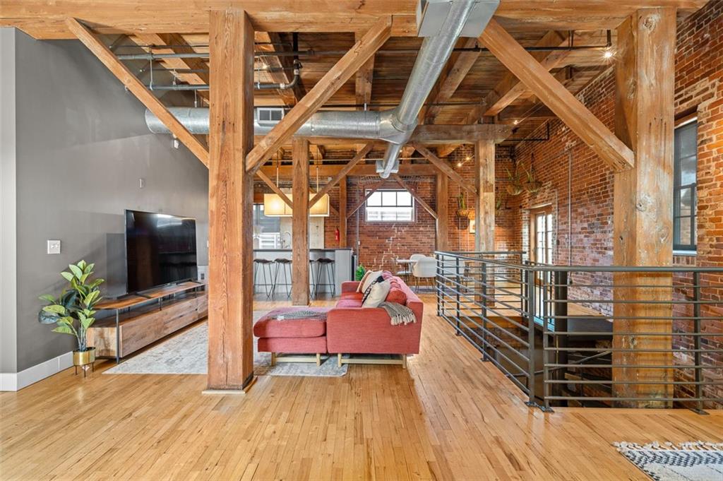 490 Marietta Street Northwest, Unit 101 Atlanta, GA 30313 - Photo 11 of 102 a living room with furniture and a flat screen tv