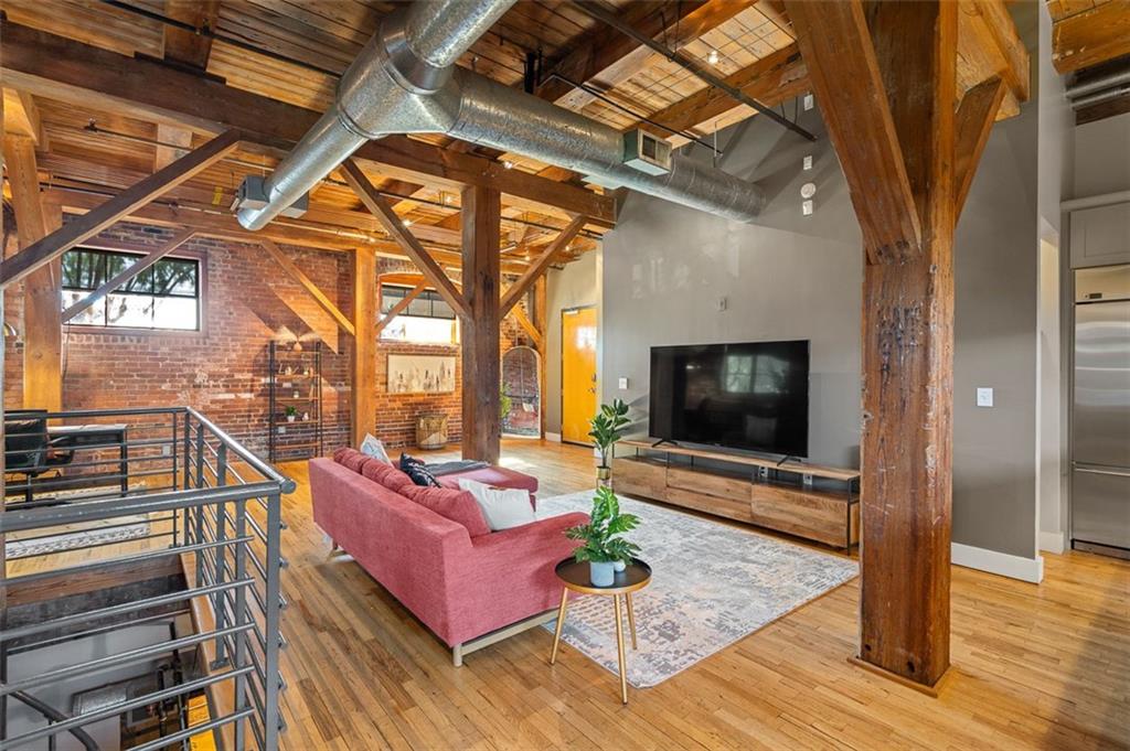 490 Marietta Street Northwest, Unit 101 Atlanta, GA 30313 - Photo 13 of 102 a living room with furniture and a flat screen tv