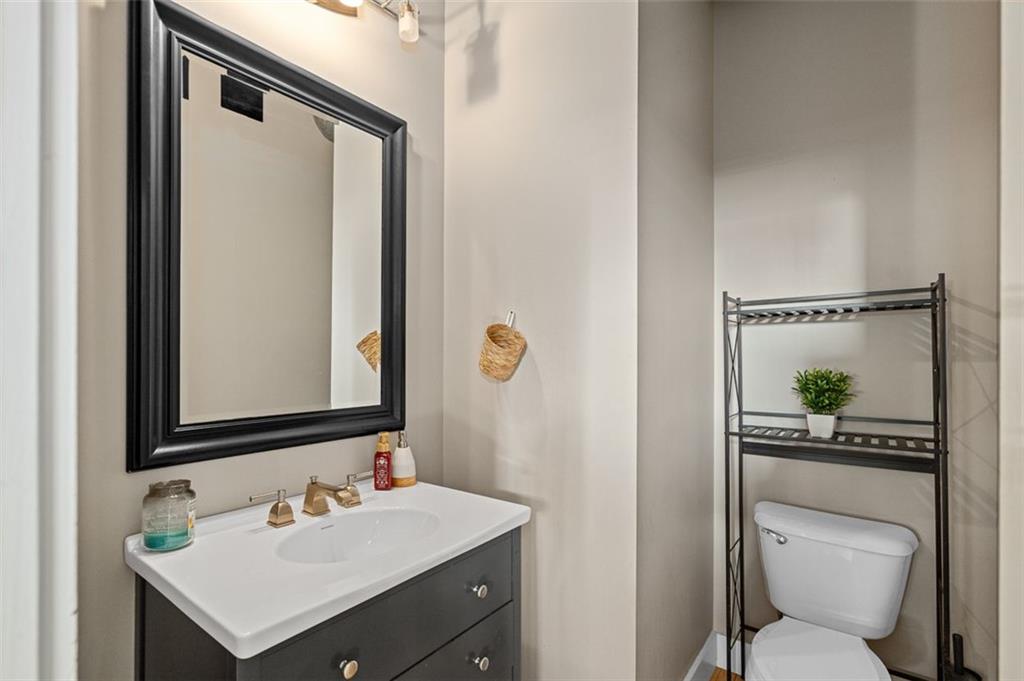 490 Marietta Street Northwest, Unit 101 Atlanta, GA 30313 - Photo 17 of 102 a bathroom with a sink a toilet and shower