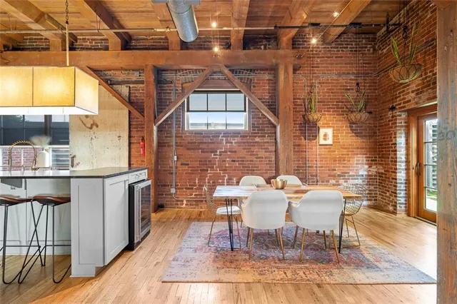 a kitchen with stainless steel appliances granite countertop white cabinets and a granite counter tops