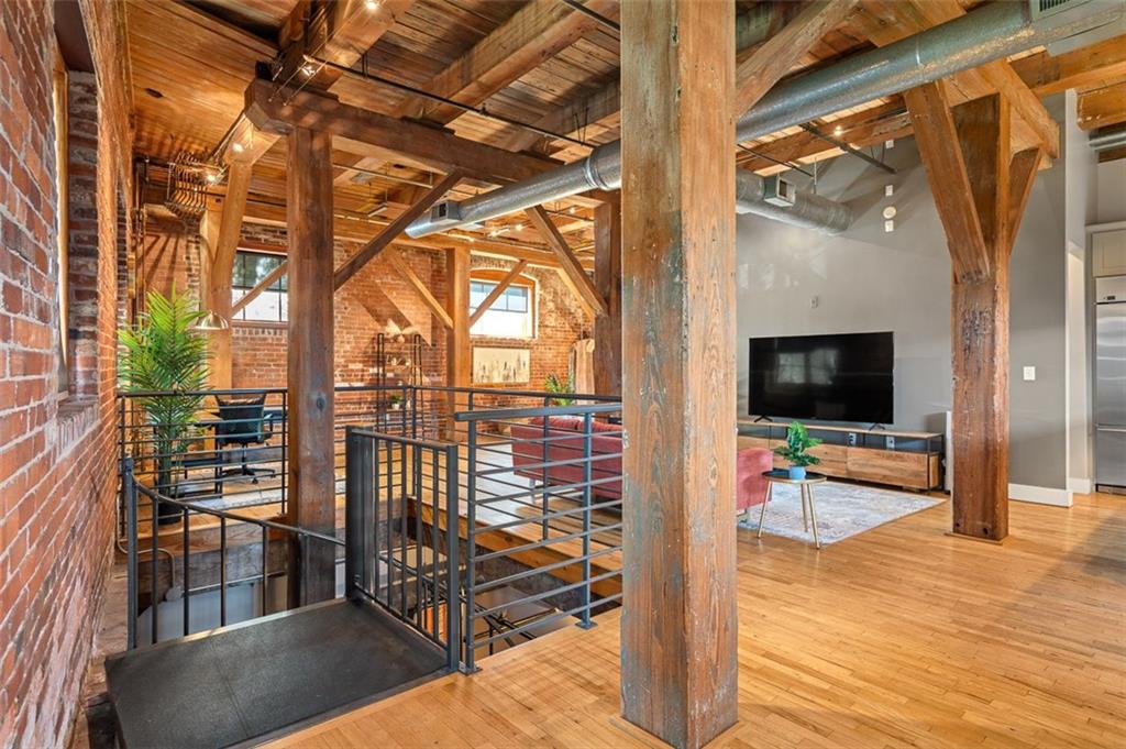 490 Marietta Street Northwest, Unit 101 Atlanta, GA 30313 - Photo 21 of 102 a view of outdoor living room with furniture and wooden floor