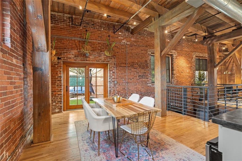 490 Marietta Street Northwest, Unit 101 Atlanta, GA 30313 - Photo 24 of 102 a patio with table and chairs