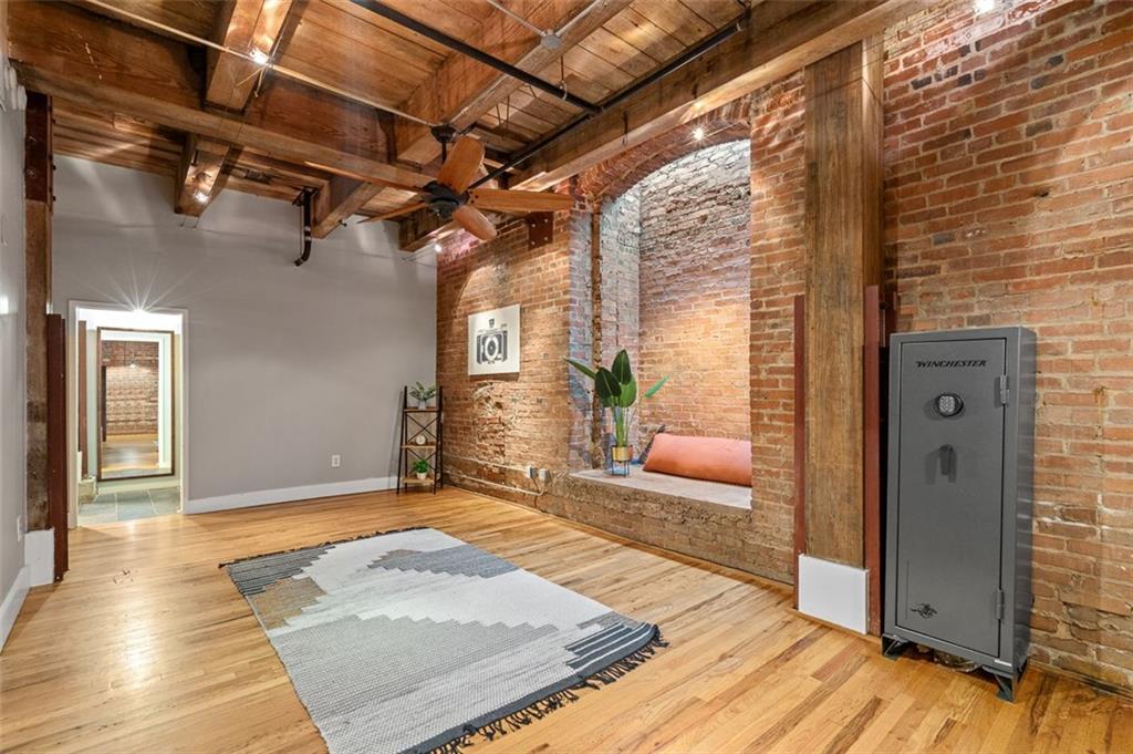490 Marietta Street Northwest, Unit 101 Atlanta, GA 30313 - Photo 45 of 102 a view of a porch with wooden floor and a fireplace