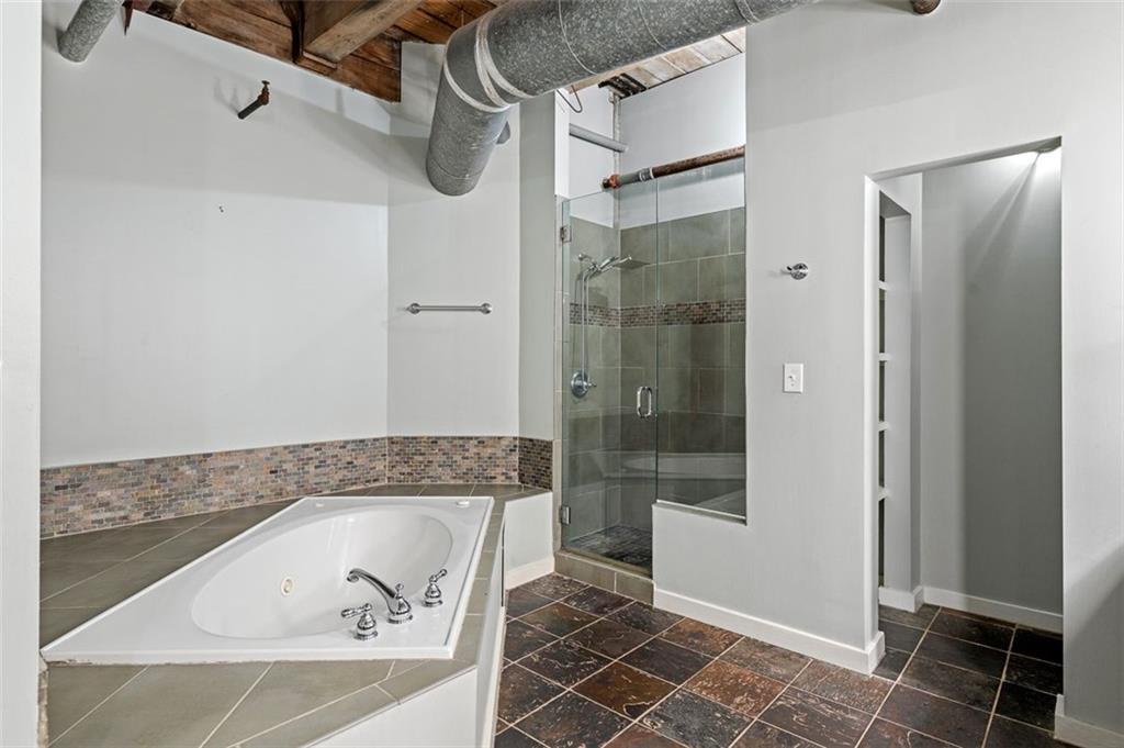 490 Marietta Street Northwest, Unit 101 Atlanta, GA 30313 - Photo 47 of 102 a bathroom with a bathtub and shower