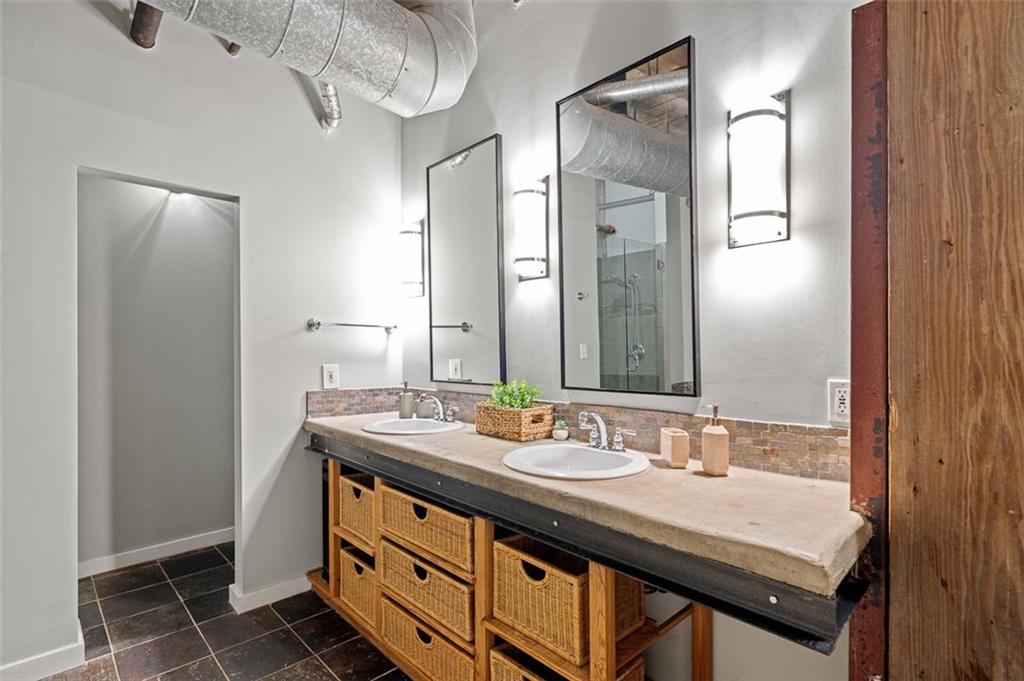 490 Marietta Street Northwest, Unit 101 Atlanta, GA 30313 - Photo 48 of 102 a bathroom with a double vanity sink and a mirror