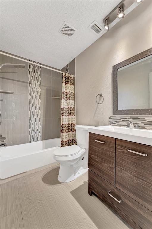 13300 Walsingham Road, Unit 56 Largo, FL 33774 - Photo 23 of 35 a bathroom with a sink toilet and shower