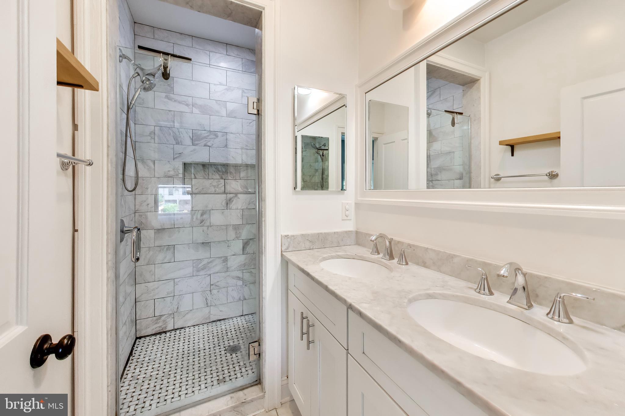 1910 4th Street Northwest Washington, DC 20001 - Photo 13 of 20 a bathroom with a sink double vanity and shower