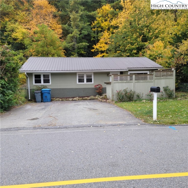 151 Rogers Drive Boone, NC 28607 - Photo 1 of 15 a front view of a house with a yard and trees