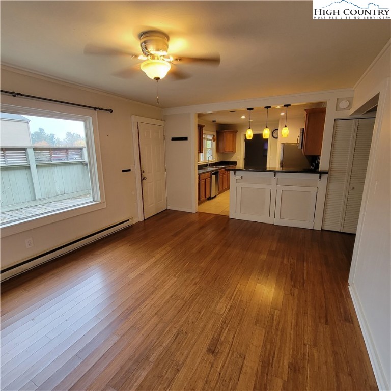 151 Rogers Drive Boone, NC 28607 - Photo 3 of 15 a living room with hard wood floors and a kitchen