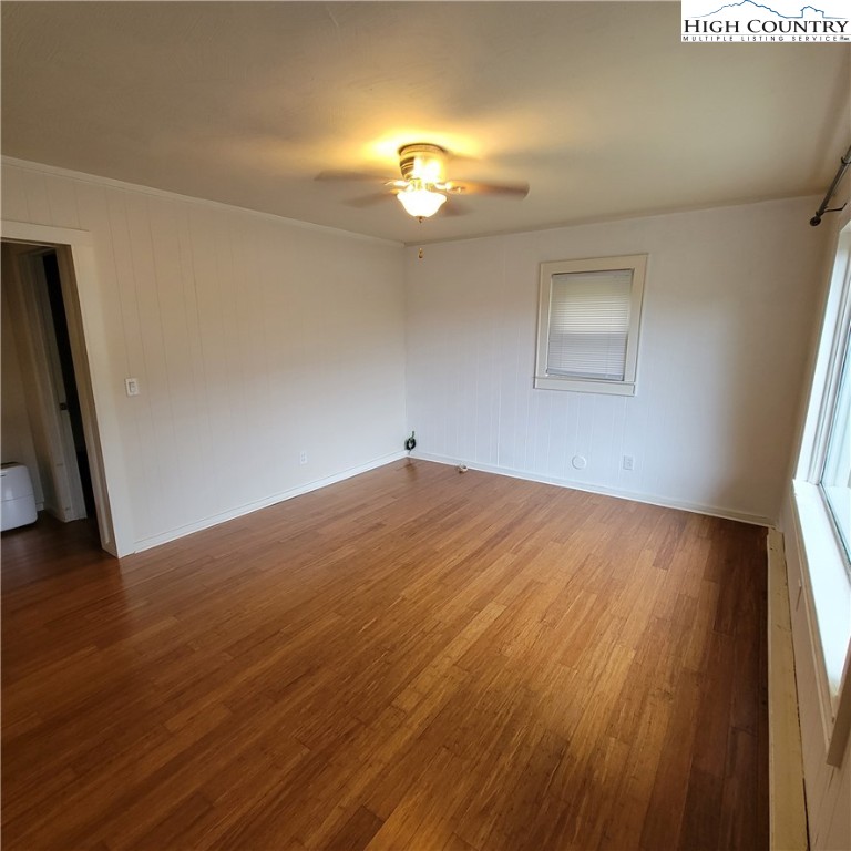 151 Rogers Drive Boone, NC 28607 - Photo 4 of 15 a view of empty room with wooden floor and fan