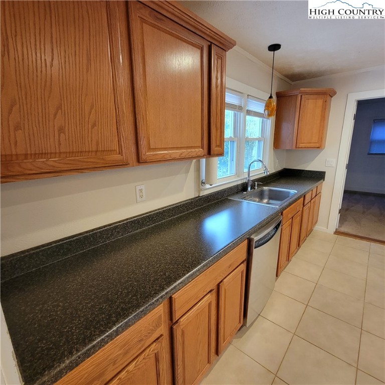 151 Rogers Drive Boone, NC 28607 - Photo 7 of 15 a kitchen with stainless steel appliances a sink dishwasher a stove and a microwave oven