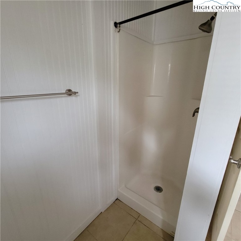 151 Rogers Drive Boone, NC 28607 - Photo 10 of 15 a bathroom with a glass shower door
