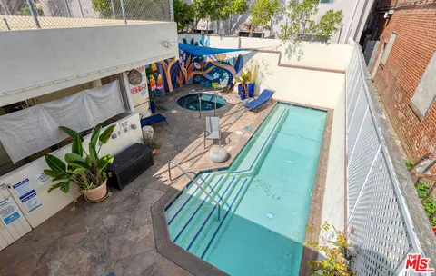 a swimming pool with outdoor seating