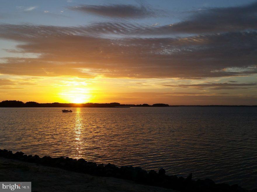 38126 Brant Road Ocean View, DE 19970 - Photo 2 of 34 Serene sunset over tranquil waters.