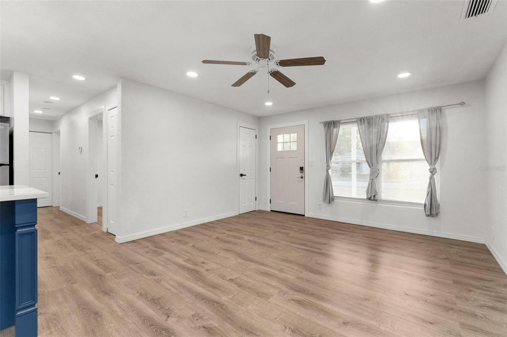 2203 Nottingham Road South Daytona, FL 32119 - Photo 15 of 40 a view of an empty room with wooden floor and a window