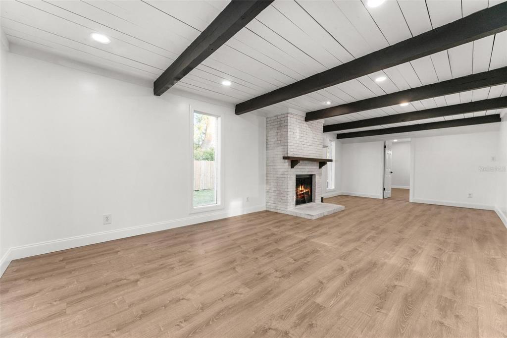 2203 Nottingham Road South Daytona, FL 32119 - Photo 16 of 40 a view of empty room with a fireplace and window