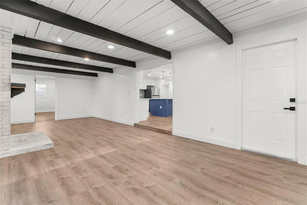 2203 Nottingham Road South Daytona, FL 32119 - Photo 17 of 40 a view of empty room with wooden floor and cabinet