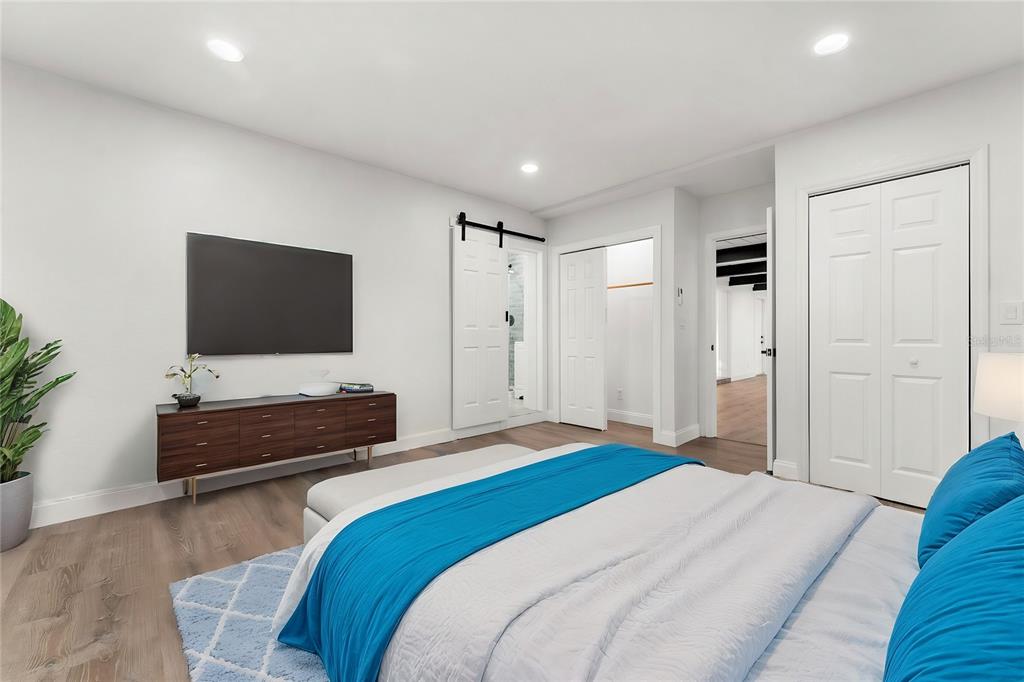 2203 Nottingham Road South Daytona, FL 32119 - Photo 22 of 40 a bedroom with bed and flat screen tv