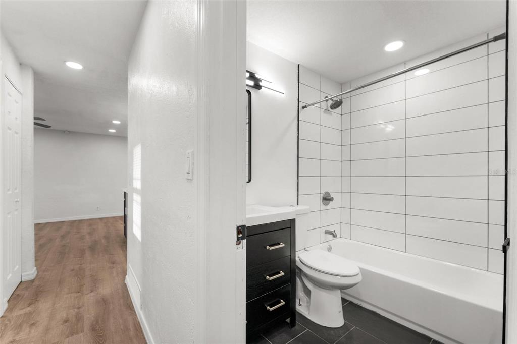 2203 Nottingham Road South Daytona, FL 32119 - Photo 28 of 40 a bathroom with a toilet a sink and bathtub