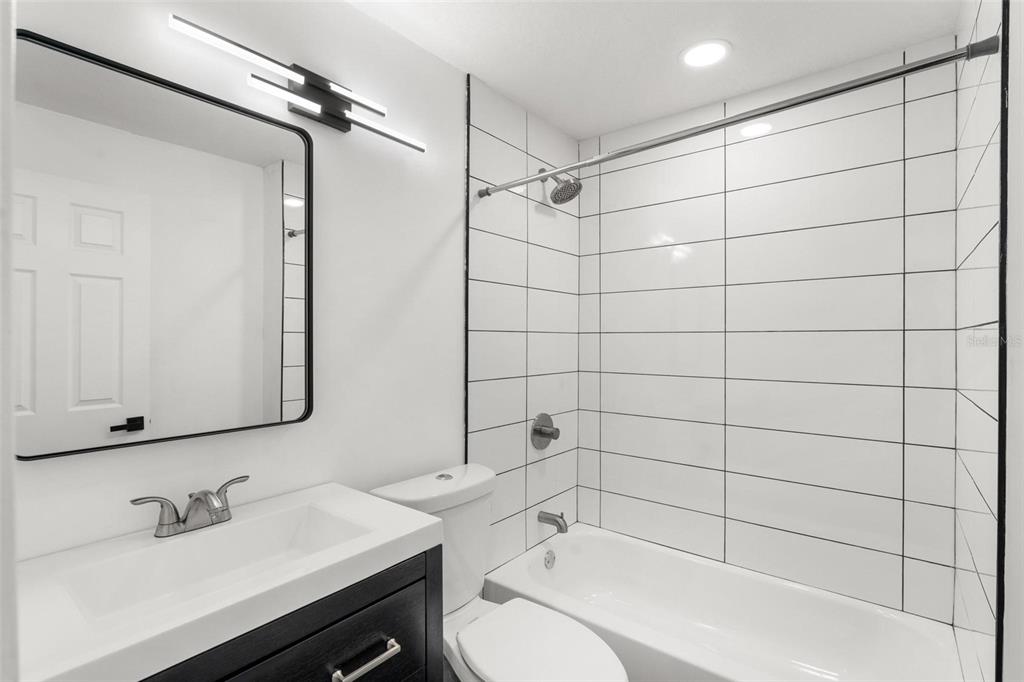 2203 Nottingham Road South Daytona, FL 32119 - Photo 29 of 40 a bathroom with a sink toilet and shower