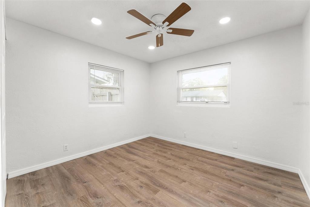 2203 Nottingham Road South Daytona, FL 32119 - Photo 30 of 40 an empty room with wooden floor and windows