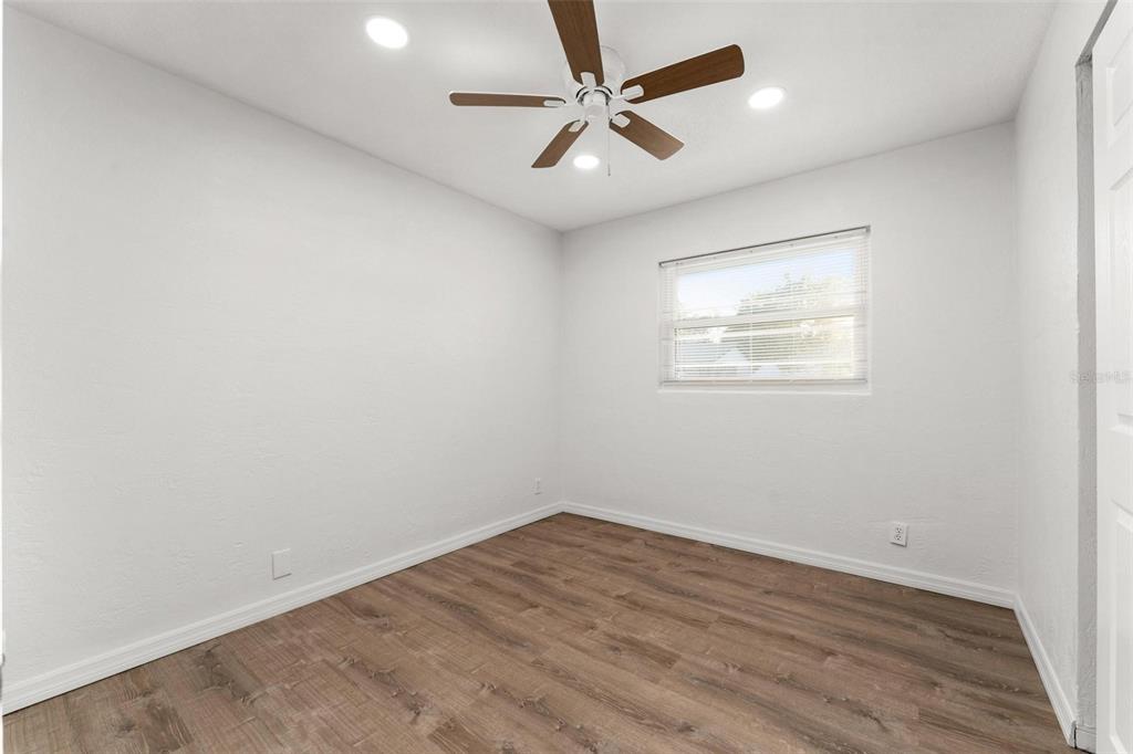 2203 Nottingham Road South Daytona, FL 32119 - Photo 32 of 40 an empty room with wooden floor and windows